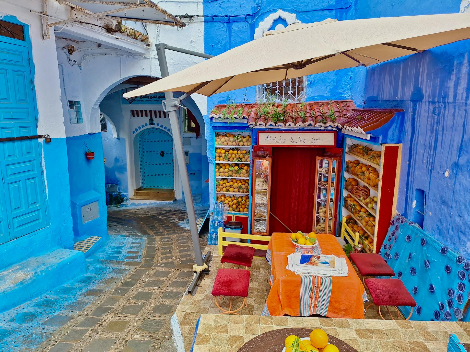 A beautiful traditional Moroccan room in a Chefchaouen hotel with blue decor.